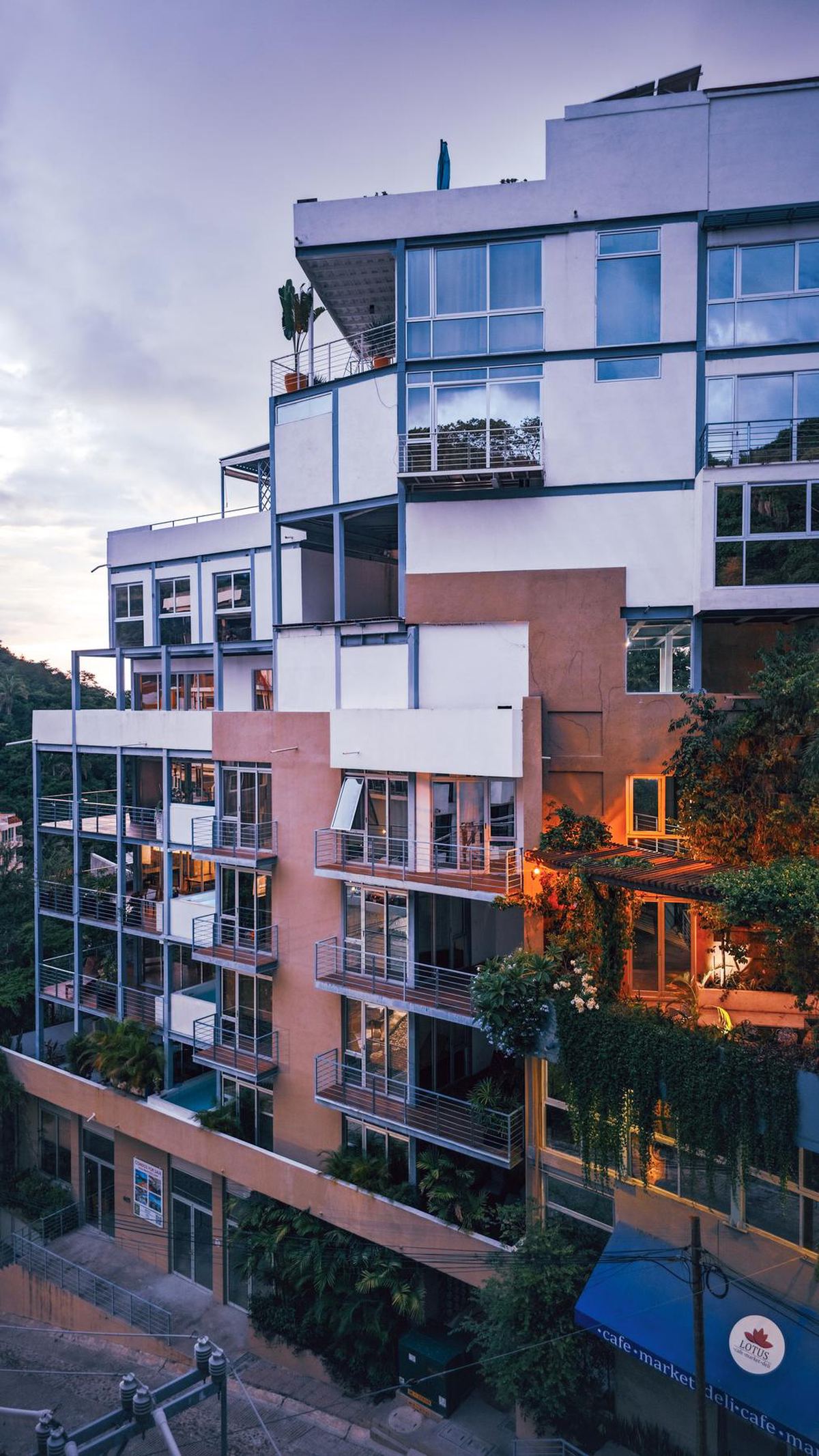 A modern apartment building at dusk